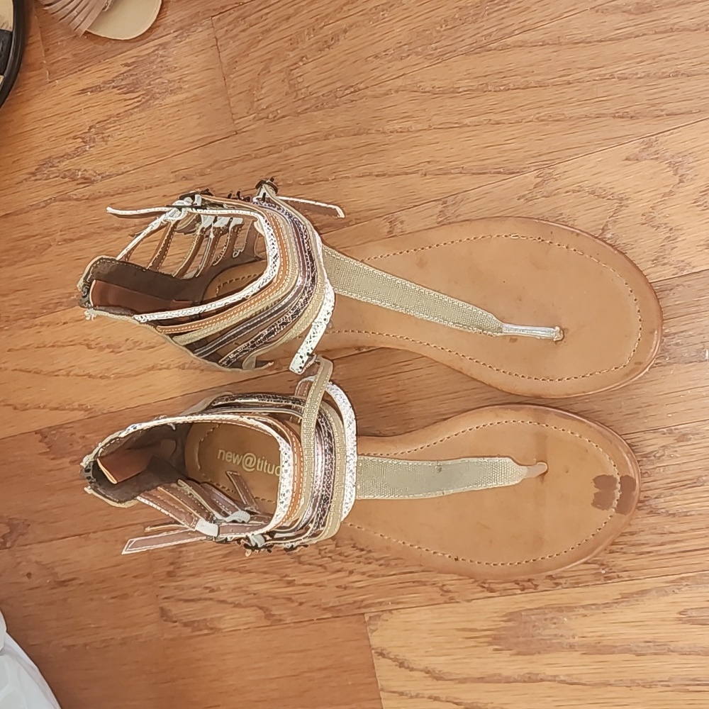 Leather sandals with straps around ankles